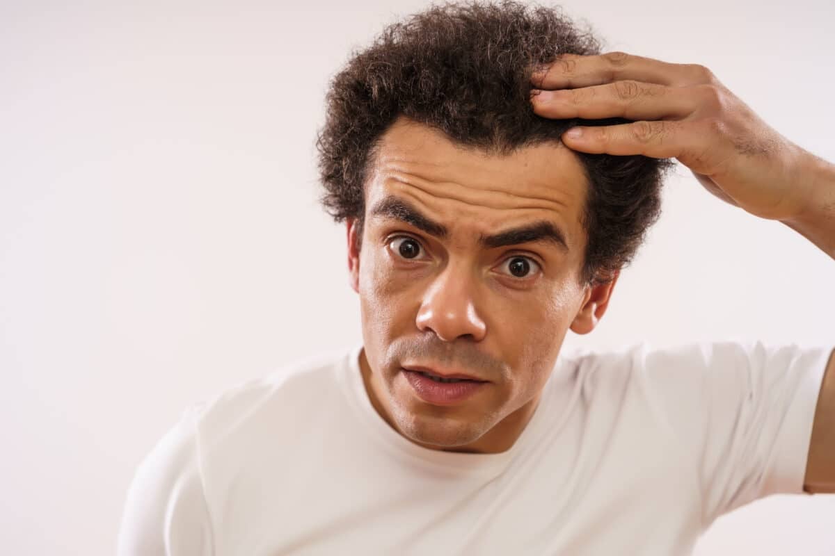 Man with a widow's peak illustrating the genetic and health factors behind this distinctive hairline trait