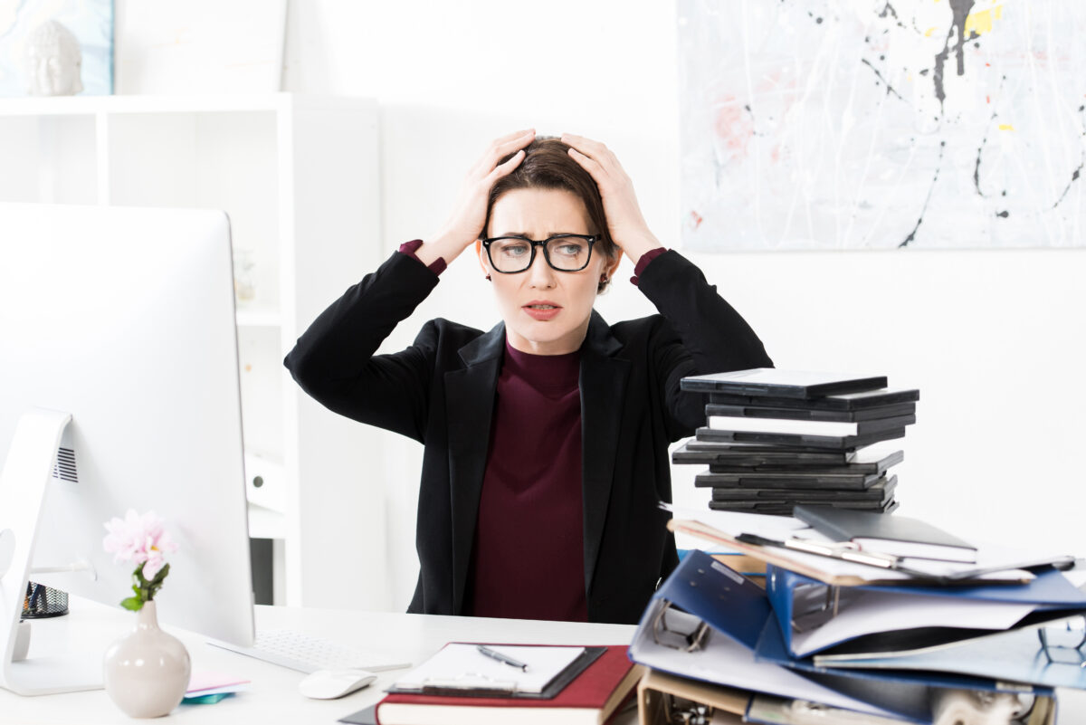 Image of an irritable woman with a frustrated expression, highlighting the emotional impact of genetics on mood