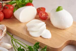 freshly sliced mozzarella cheese to represent vitamin K2