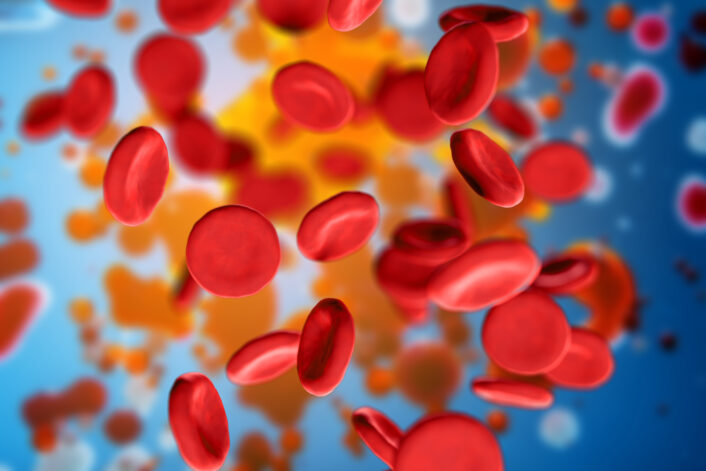 Close-up of red blood cells, symbolizing the effects of iron overload in Hereditary Hemochromatosis on the bloodstream and organs