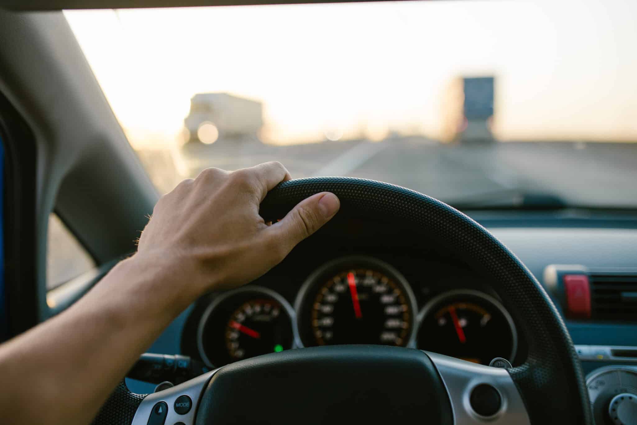 Speeding car on the highway representing the concept of automobile speeding tendency with possible genetic influences