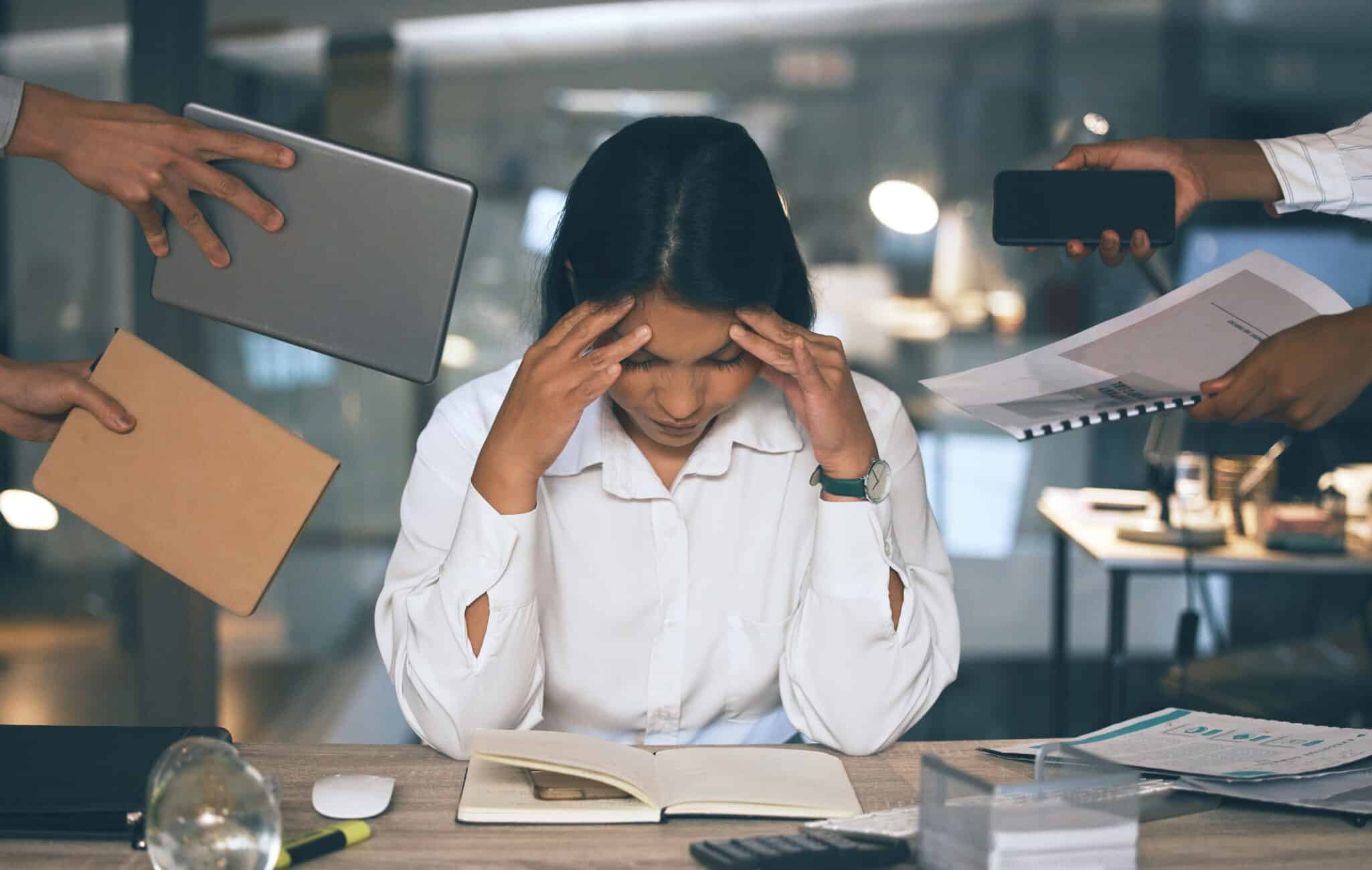 A stressed woman surrounded by symbolic stressors like deadlines, bills, and time pressure—representing high sensitivity to stress.