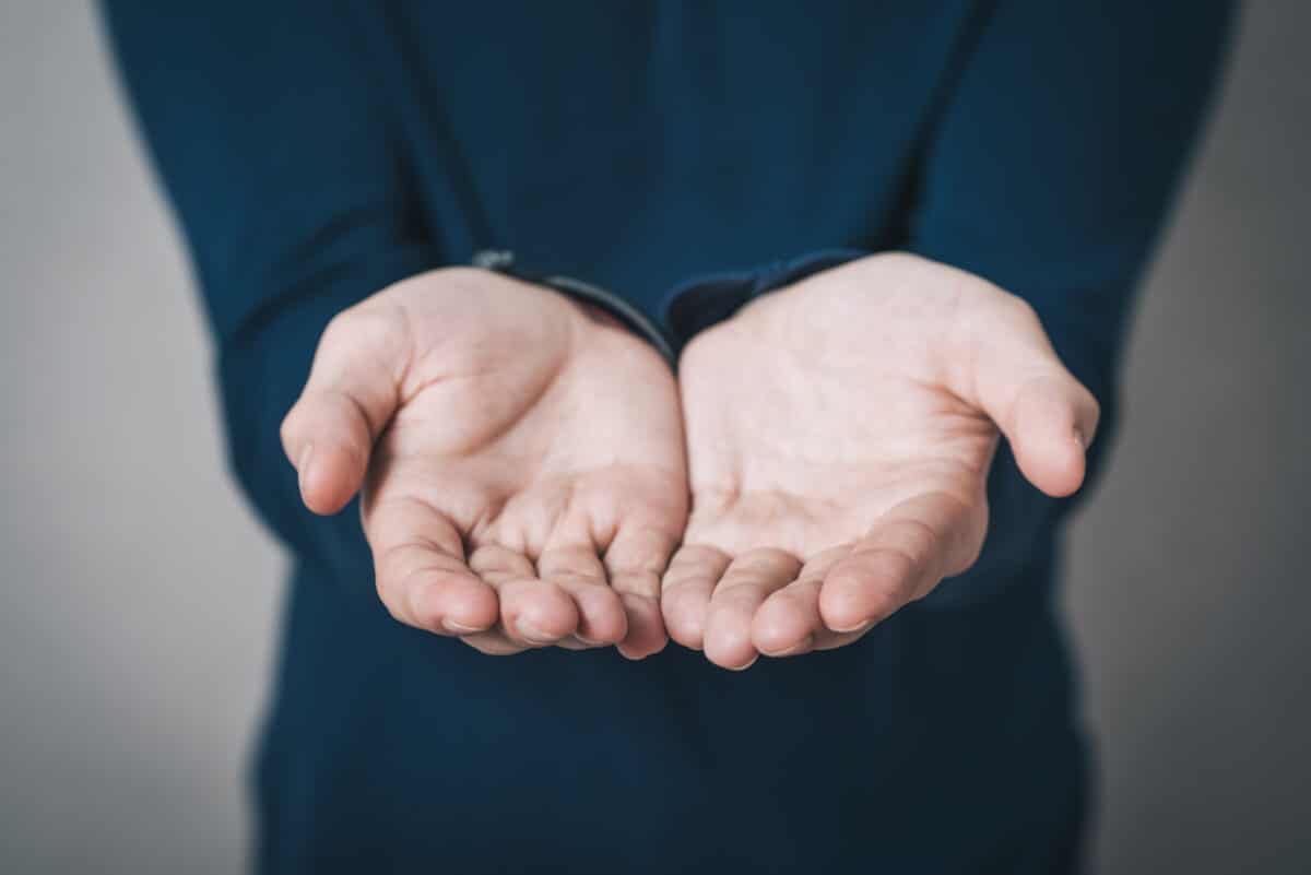 Open palm hands showing signs of Raynaud’s disease with pale or bluish fingers
