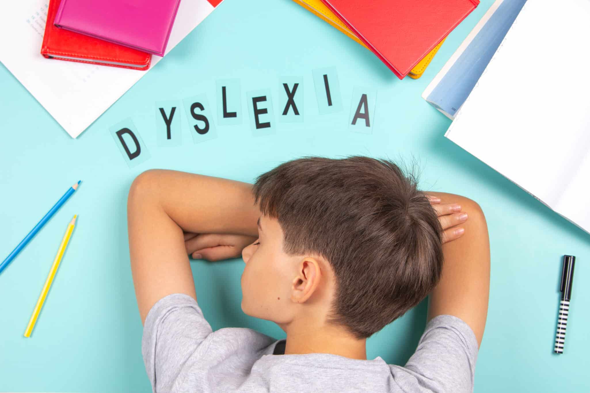 Child with dyslexia surrounded by jumbled letters representing reading difficulty.