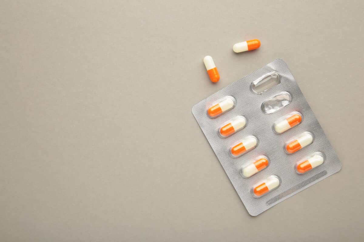 Close-up of a statin pill, representing the role of genetic data.