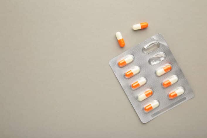 Close-up of a statin pill, representing the role of genetic data.
