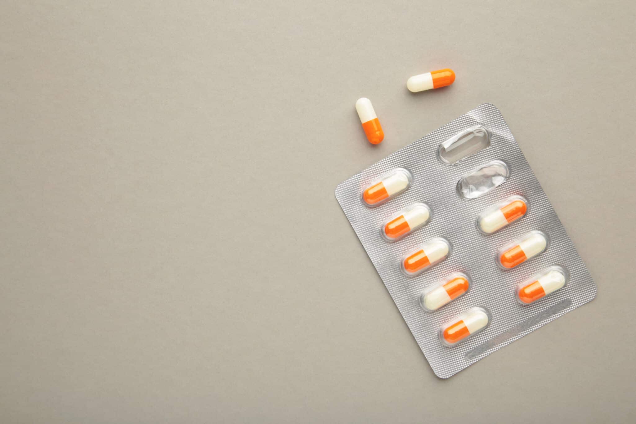 Close-up of a statin pill, representing the role of genetic data.